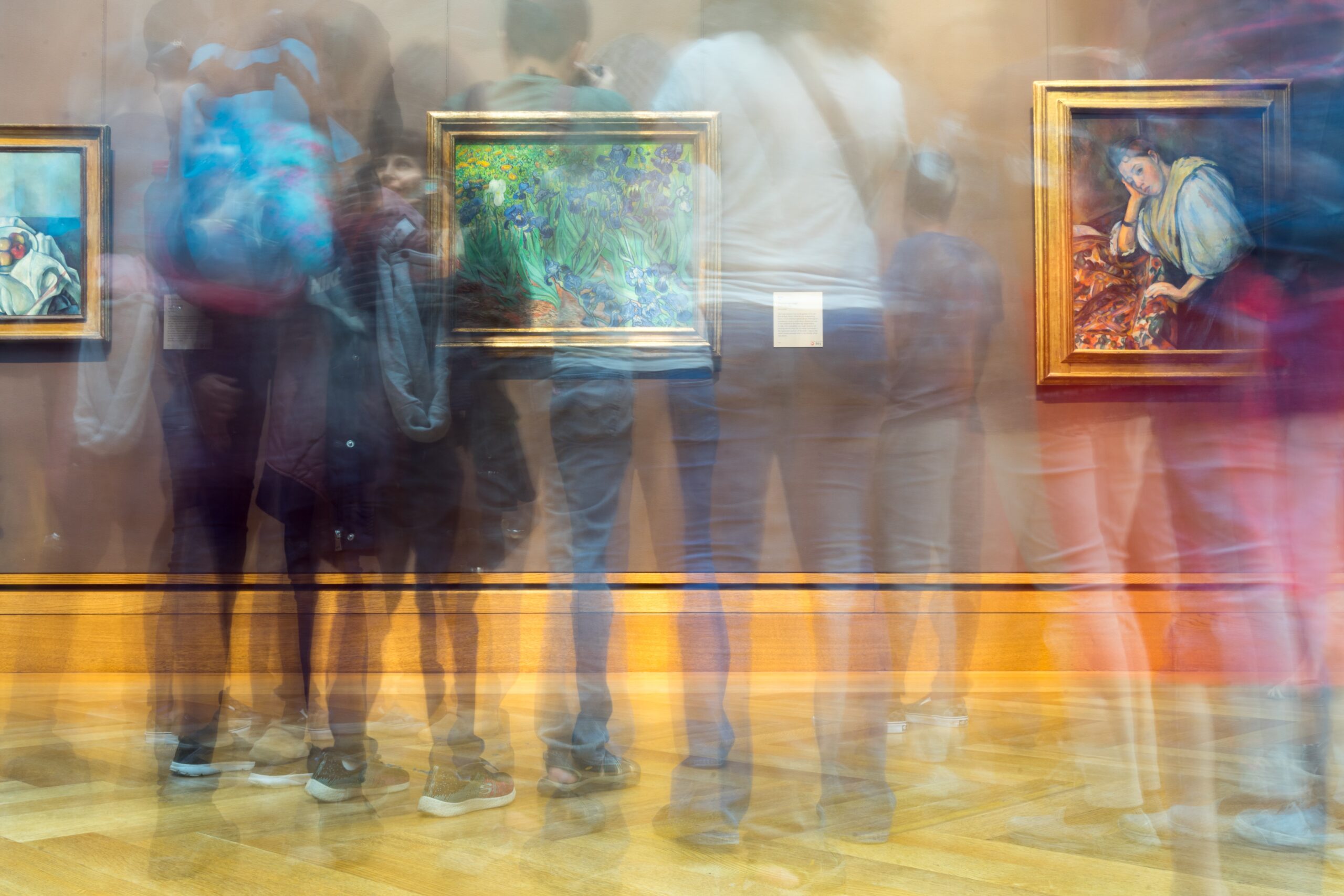 NEOSLOGOS MUSEUM MUSEUM WITH PEOPLE LOOKING AT A GALLERY OF PAINTINGS